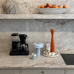 The Affiné Portable Lamp in Powder Blue in hand-blown glass.