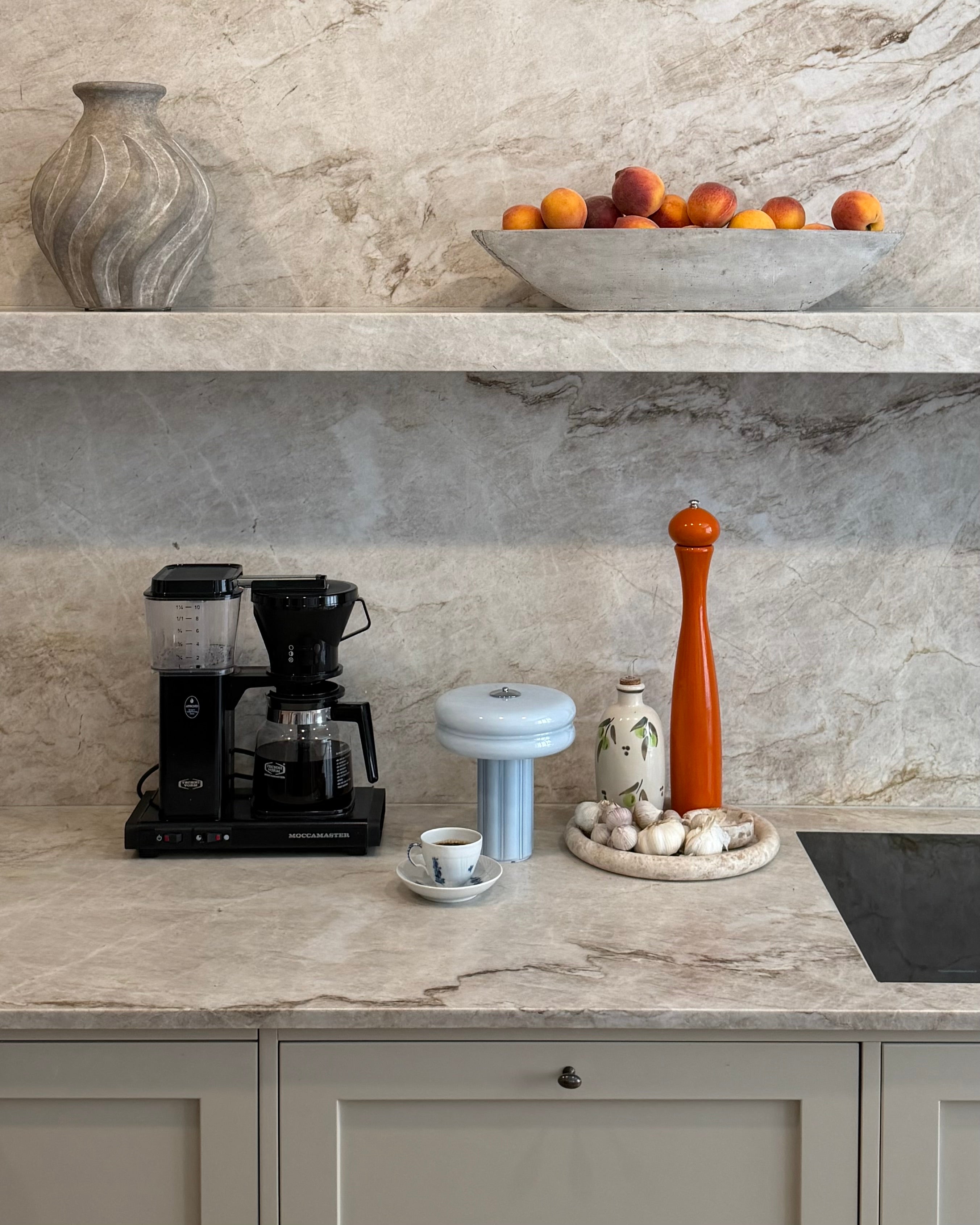 The Affiné Portable Lamp in Powder Blue in hand-blown glass.