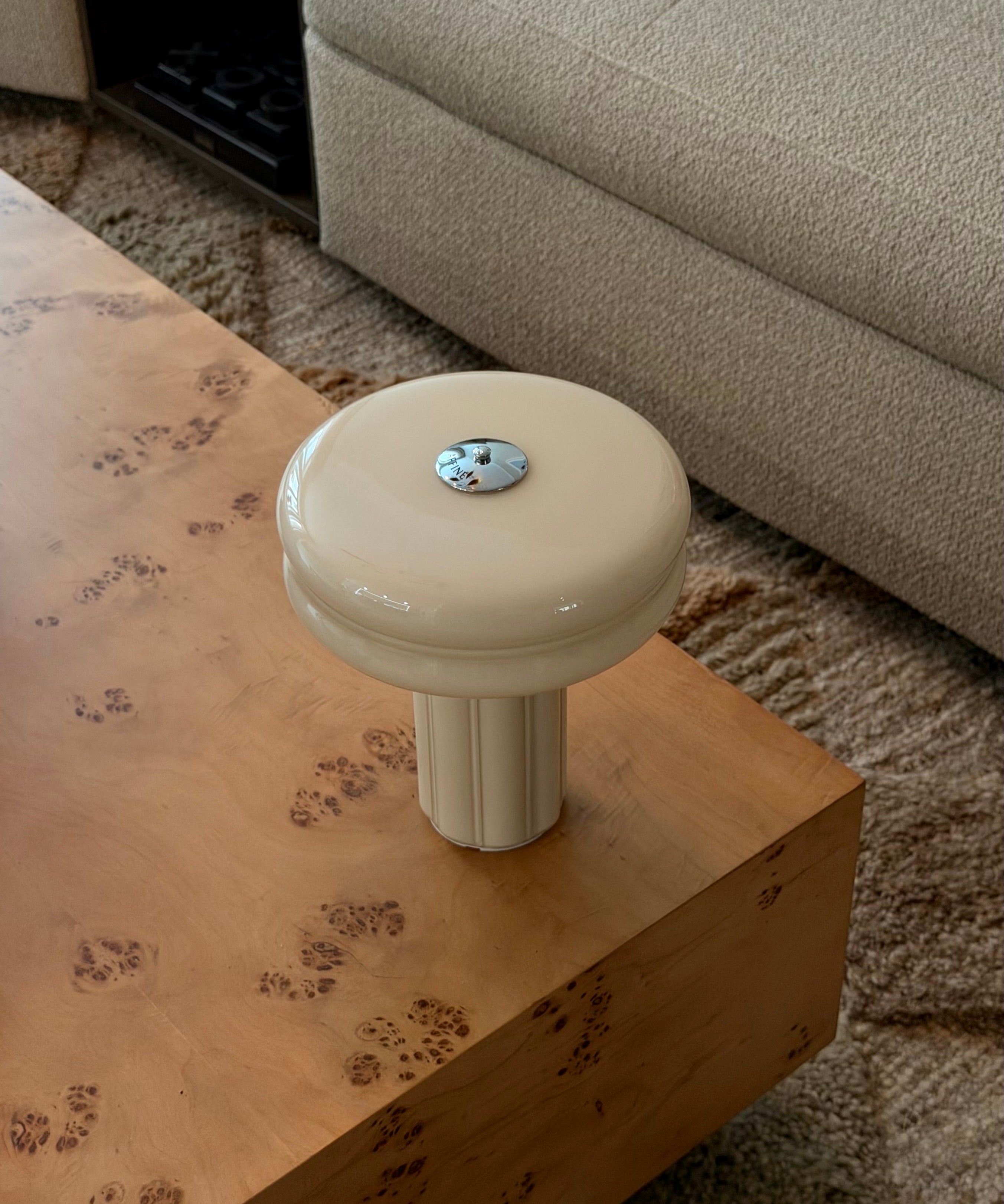 The Affiné Portable Lamp in Crème Beige in hand-blown glass.