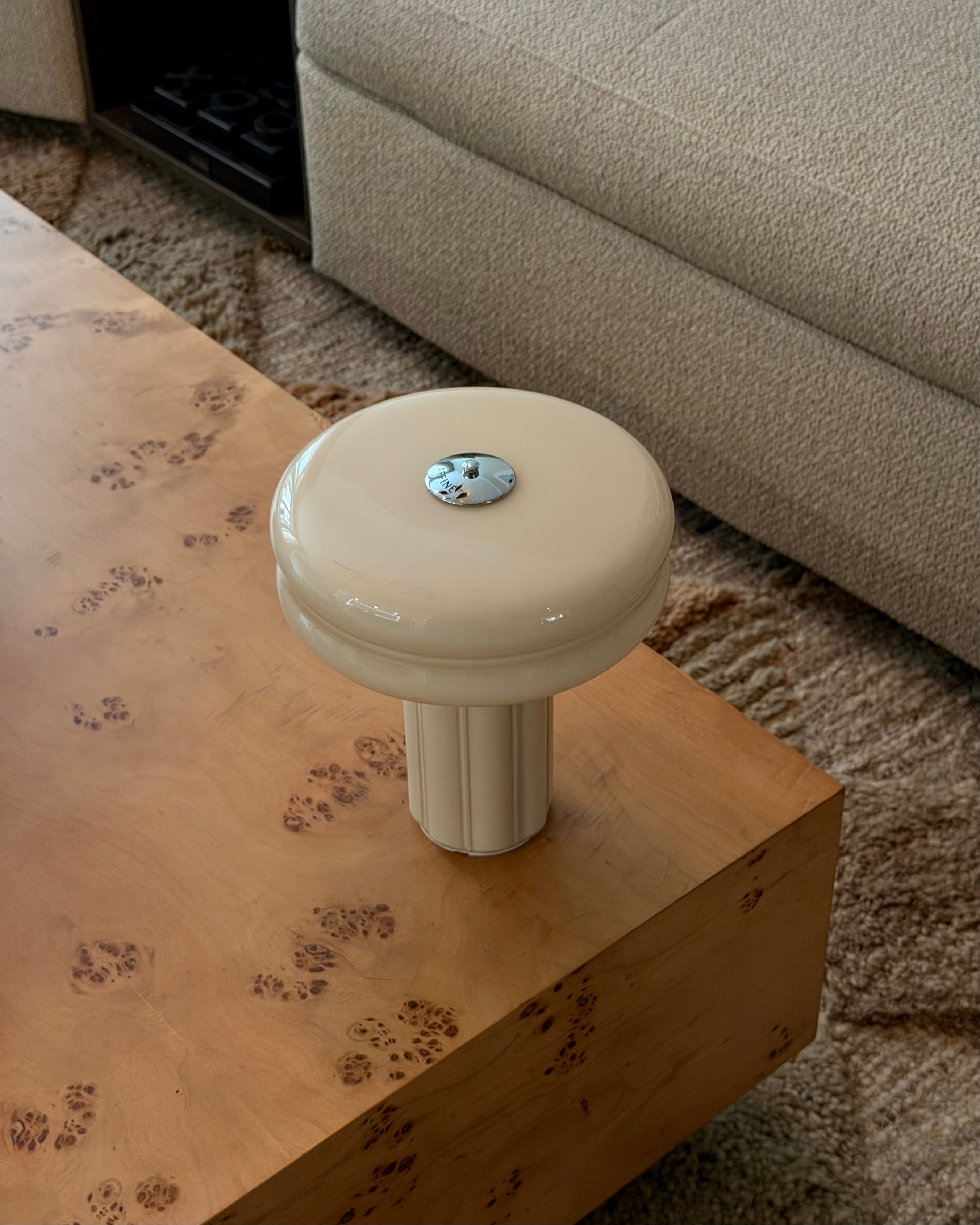 The Affiné Portable Lamp in Crème Beige in hand-blown glass.