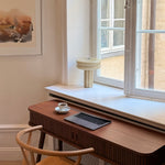 The Affiné Table Lamp in Crème Beige in hand-blown glass.