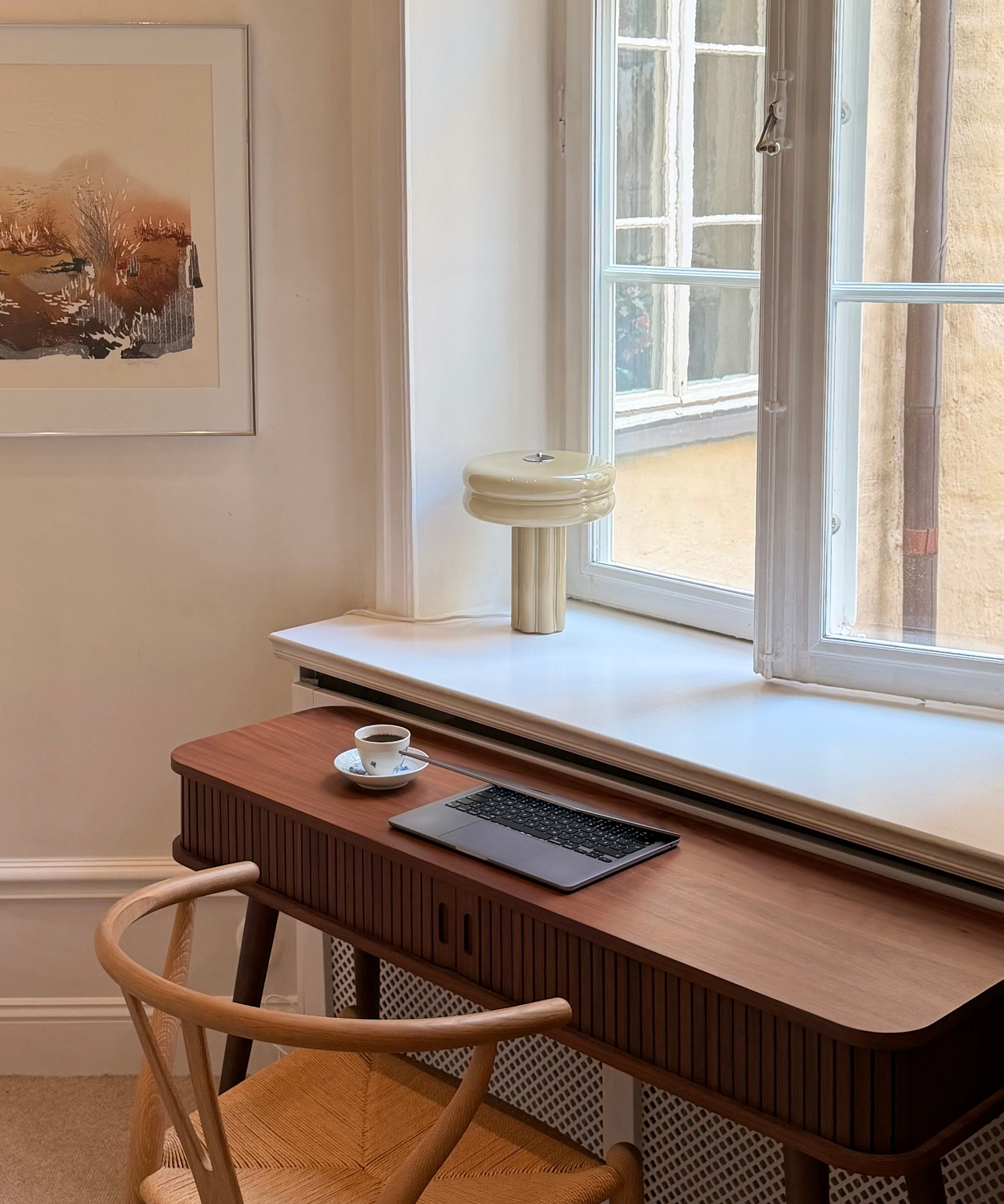 The Affiné Table Lamp in Crème Beige in hand-blown glass.
