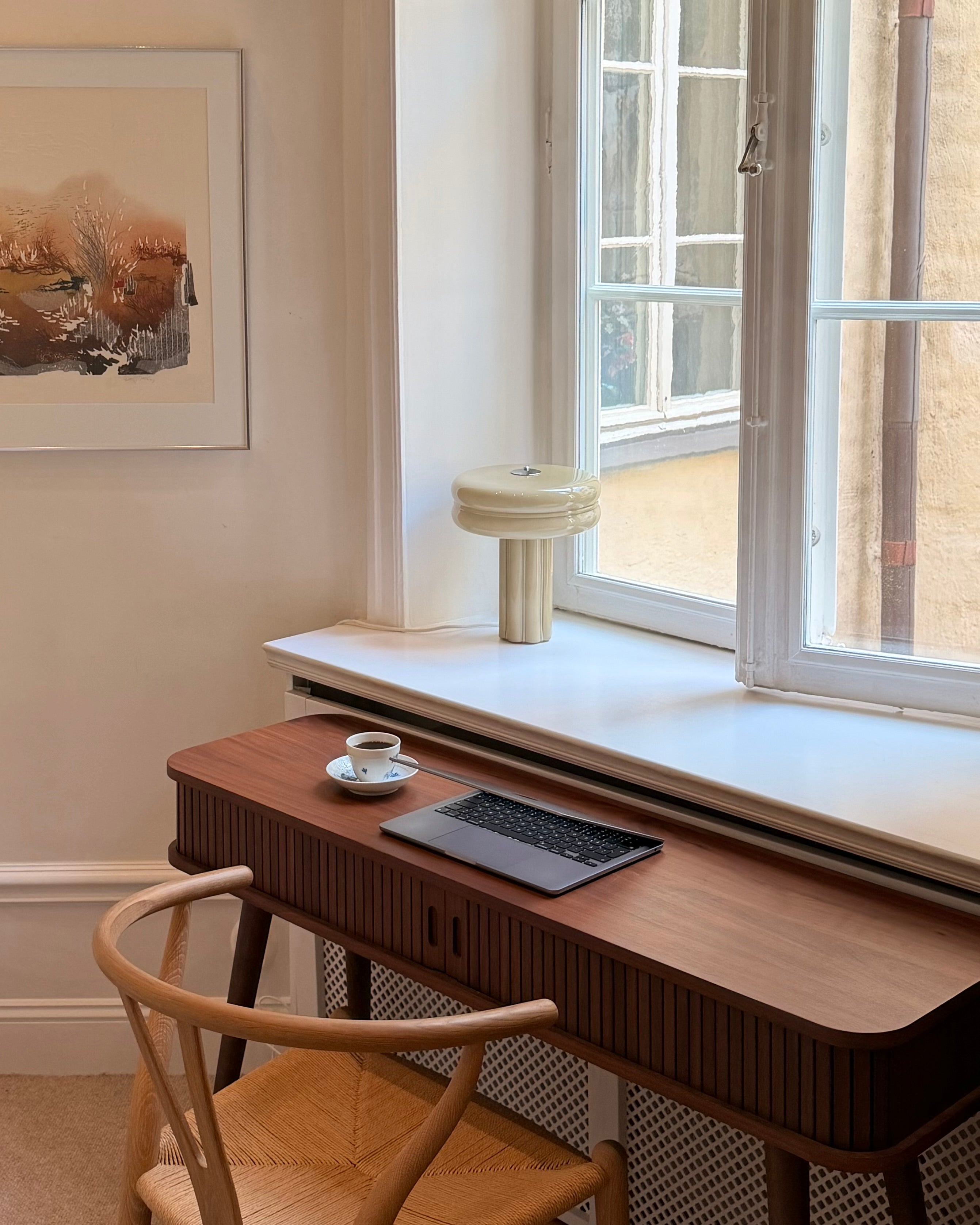 The Affiné Table Lamp in Crème Beige in hand-blown glass.