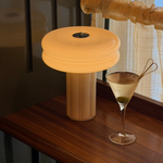 The Affiné Portable Lamp in Crème Beige creating a warm evening glow.