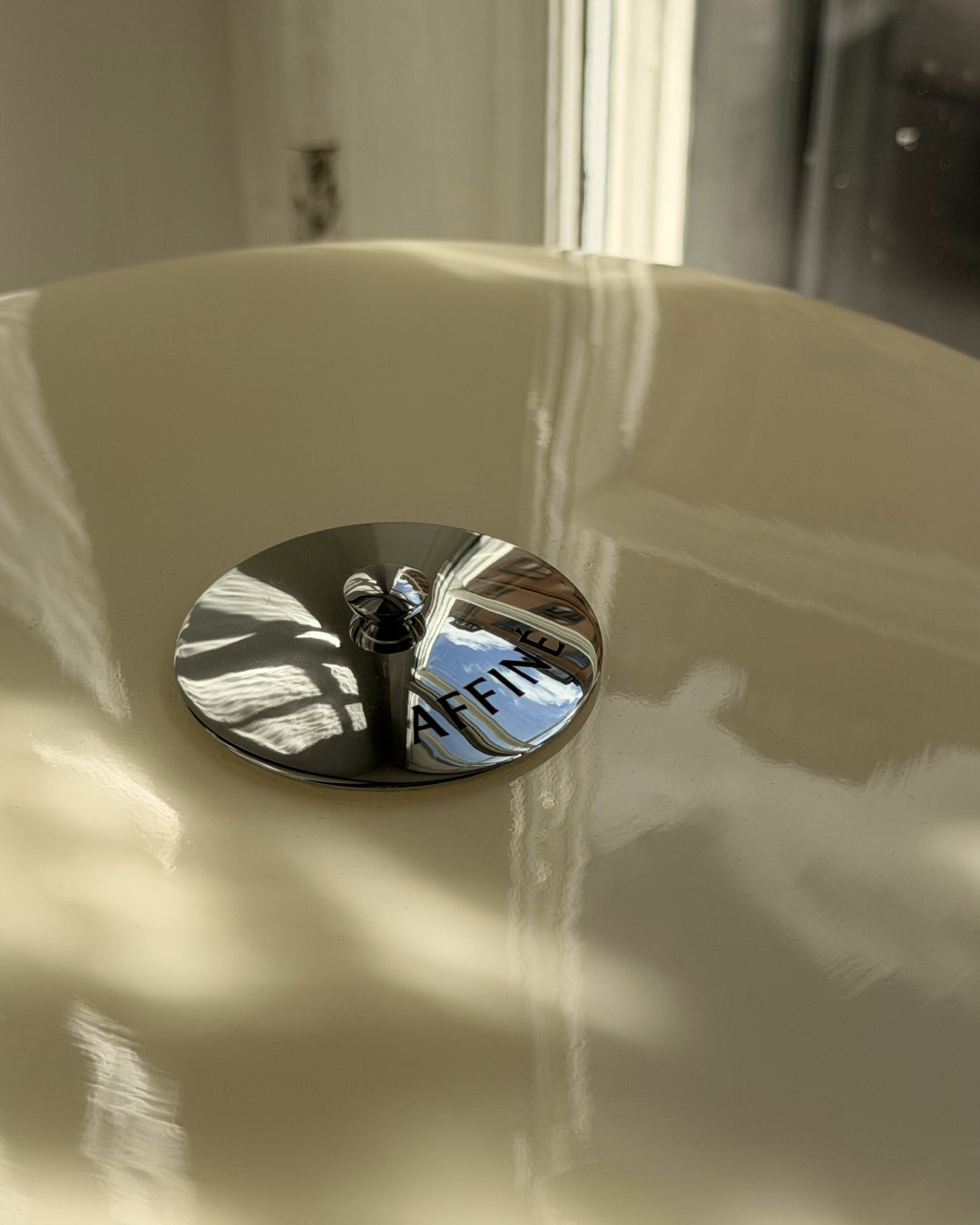 Close-up of the Affiné Portable Lamp in Crème Beige.