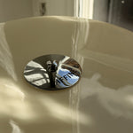 Close-up of the Affiné Portable Lamp in Crème Beige.