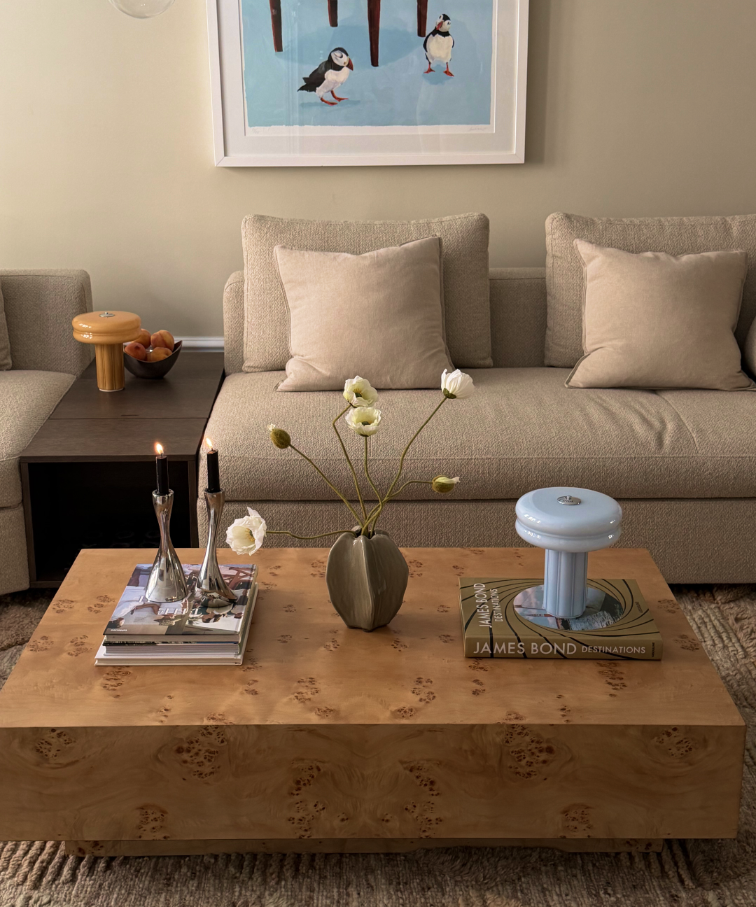 Affiné Portable Lamp in Powder Blue styled on a table.
