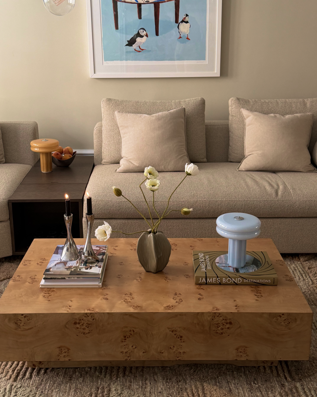 Affiné Portable Lamp in Powder Blue styled on a table.