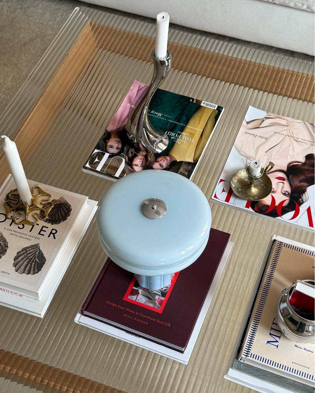 The Affiné Portable Lamp in Powder Blue casting a soft glow.