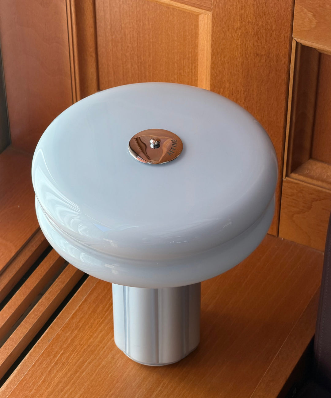 Close-up of the Affiné Portable Lamp in Powder Blue.