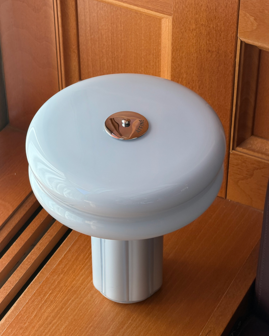 Close-up of the Affiné Portable Lamp in Powder Blue.