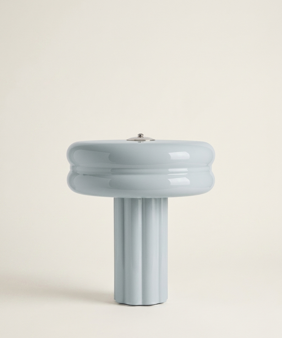 The Affiné Portable Lamp in Powder Blue – hand-blown glass with polished aluminium top.