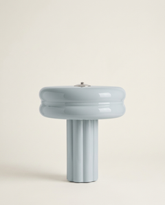The Affiné Portable Lamp in Powder Blue – hand-blown glass with polished aluminium top.