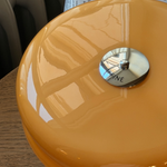 Close-up of the Affiné Portable Lamp in Soft Amber.
