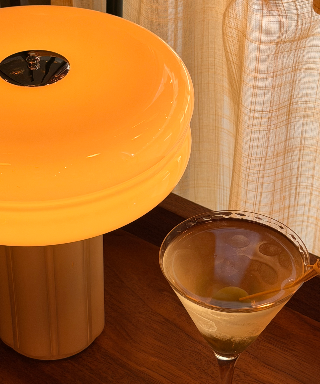 The Affiné Portable Lamp in Soft Amber creating a warm evening glow.