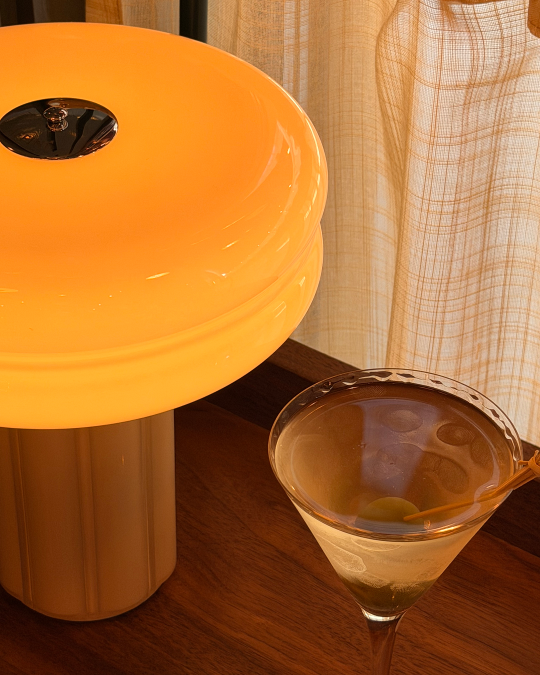 The Affiné Portable Lamp in Soft Amber creating a warm evening glow.