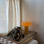 Sculptural Portable Lamp in Soft Amber made from hand-blown glass.