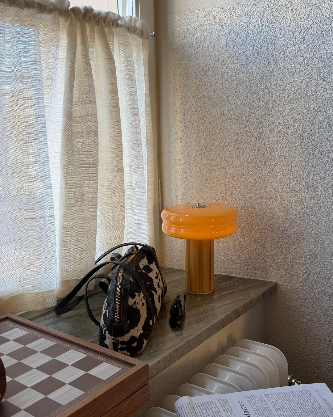 Sculptural Portable Lamp in Soft Amber made from hand-blown glass.