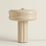 The Affiné Table Lamp in Crème Beige with textile cable – hand-blown glass.