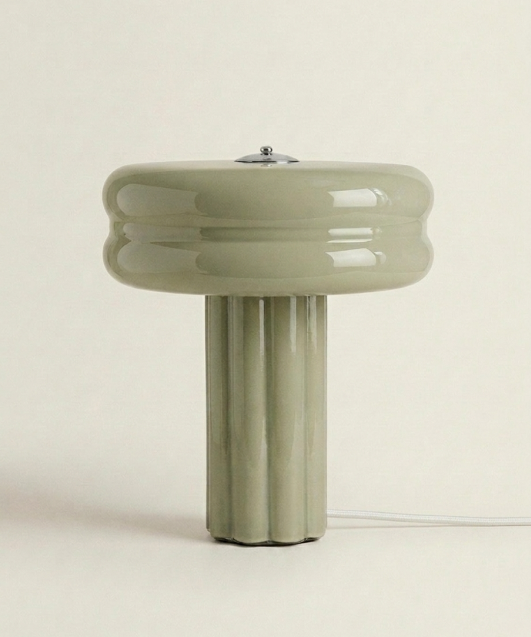 The Affiné Table Lamp in Sage Green with textile cable – hand-blown glass.